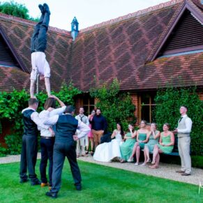Dairy Waddesdon wedding photographs of the acrobats performing to an audience