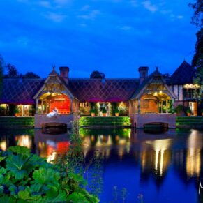 Dairy Waddesdon wedding photographs over the lake at dusk