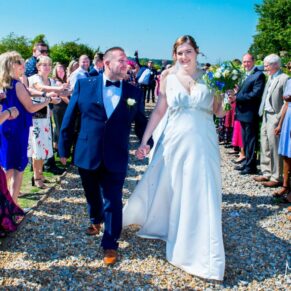Latimer Estate wedding photos of the couple walking though the confetti aisle