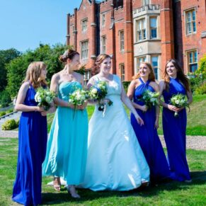 Latimer Estate wedding photos of the bride walking with her bridesmaids