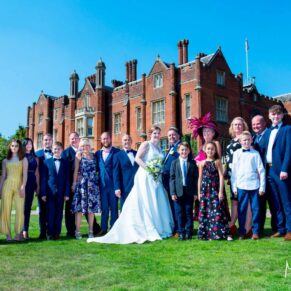 Latimer Estate wedding photos with the hotel under blue skies as the backdrop