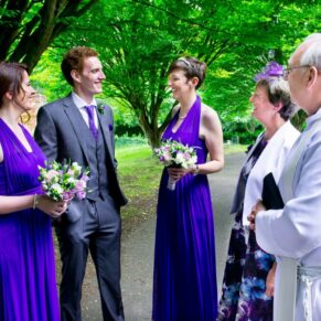 Wedding at St Mary's Church Thame - chatting to the vicar pre ceremony