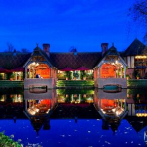 Dairy, Waddesdon Christmas wedding view across the lake at dusk
