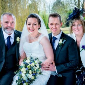 The newlyweds and parents at their Dairy Waddesdon Spring wedding