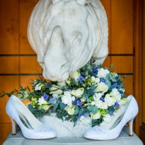 The bride's shoes and flowers at her Dairy Waddesdon Spring wedding