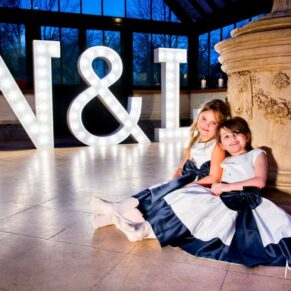 The flower girls strike a pose at Dairy Waddesdon Spring wedding