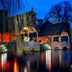 Across the lake at dusk at Dairy Waddesdon Spring wedding