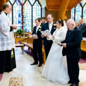 The vows at St Josephs Church wedding in Thame