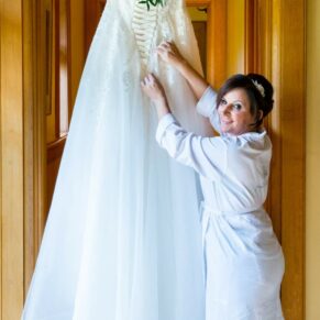 The bride with her gown at Waddesdon Dairy Christmas wedding