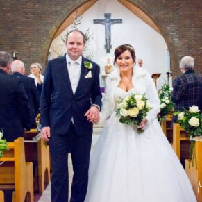 The newlyweds exit the church at St Josephs Church wedding in Thame