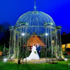 Waddesdon Dairy Christmas wedding pose after dusk with the rosary