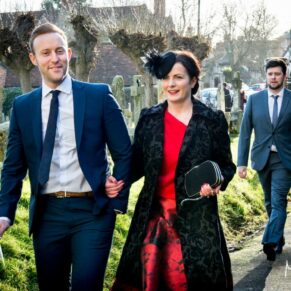 The guests walking to the ceremony at this Christmas wedding at St Mary's Church Thame