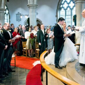 Christmas wedding ceremony in progress at St Mary's Church Thame