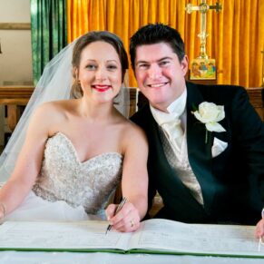 Signing of the register at this Christmas wedding at St Mary's Church in Thame