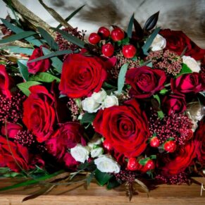 The bride's Dairy Waddesdon Christmas vibrant wedding bouquet