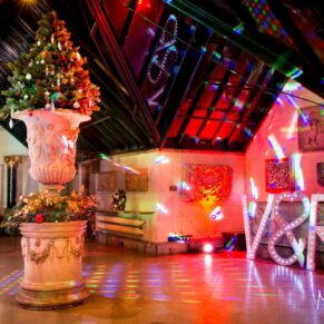 The West Hall with dramatic lighting at this Dairy Waddesdon Christmas wedding