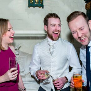 Dairy Waddesdon Christmas wedding laughter during the drinks reception