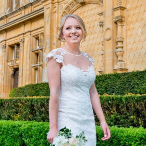 Waddesdon Manor photography shoot of the smiling bride next to the main house