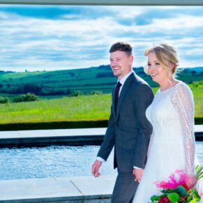 Waddesdon Manor photography shoot at Windmill Hill of the bride and groom strolling along