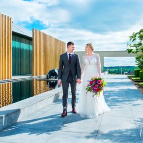 Waddesdon Manor photography shoot with the bride and groom taking a walk at Windmill Hill