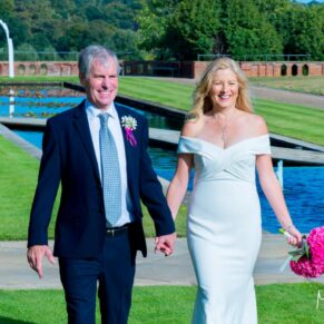 Grove Hotel Watford wedding photography of the bride and groom taking a walk in the gardens