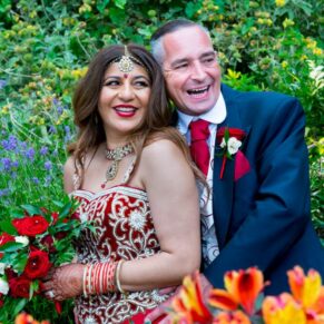 Missenden Abbey wedding blog featuring Alpana & Martin - the newlyweds amongst the flowerst