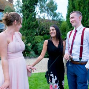 Notley Tythe Barn wedding guests catch up on the banter