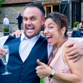 Notley Tythe Barn wedding guests enjoying their fizz