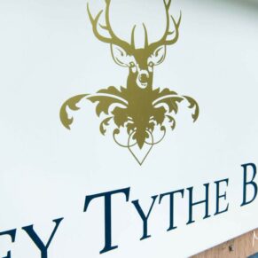 Notley Tythe Barn wedding signage at venue entrance