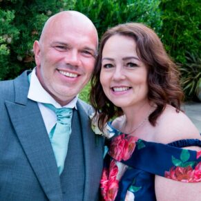 Notley Tythe Barn wedding portrait of the best man and his partner