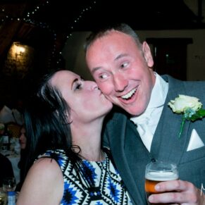 Notley Tythe Barn wedding kiss for the groom