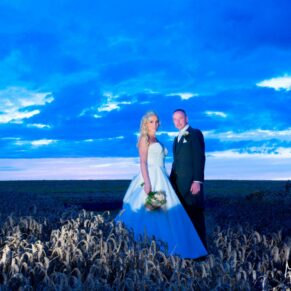 Notley Tythe Barn wedding evening shot in the wheat field