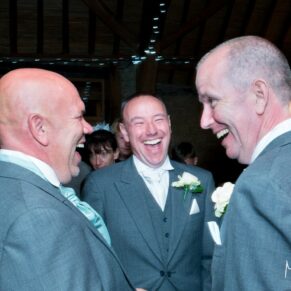 The lads catch up on the banter at Notley Tythe Barn wedding