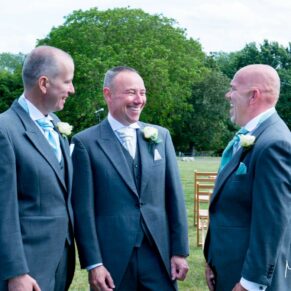 Wedding guests chatting at Notley Tythe Barn wedding