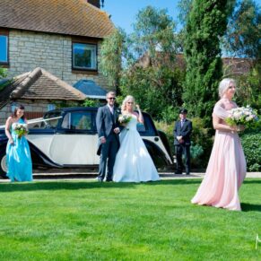 Bridesmaids arriving at ceremony at Notley Tythe Barn wedding