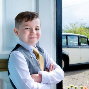 Young usher at Notley Tythe Barn wedding