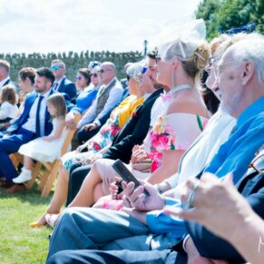 Guests in the sunshine at Notley Tythe Barn wedding