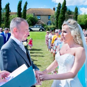 Bride chatting with guest at Notley Tythe Barn wedding