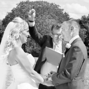 Black and white image of bride and groom at Notley Tythe Barn wedding