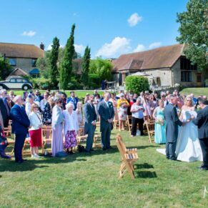 Guests enjoying the sunshine at Notley Tythe Barn wedding