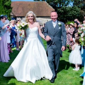 Bride and groom and guests at Notley Tythe Barn wedding