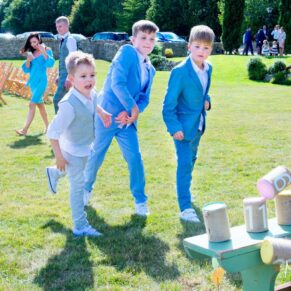 Notley Tythe Barn wedding lawn games enjoyed by these young boys