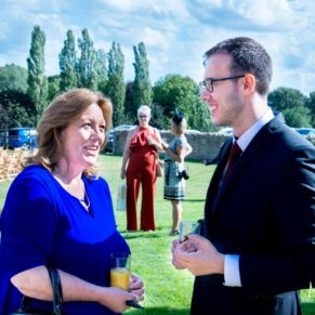 Notley Tythe Barn wedding guests enjoying a chat