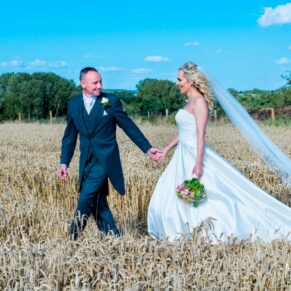 Notley Tythe Barn wedding stroll through the wheat field