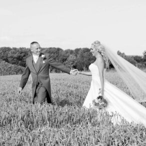 Notley Tythe Barn wedding walk through the farmers wheat field