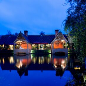 Waddesdon Dairy winter wedding photograph across the lake after sundown