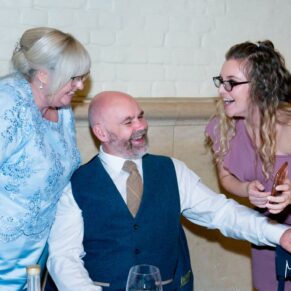 Waddesdon Dairy winter wedding photograph of the guests enjoying the party atmosphere