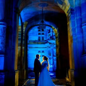 Waddesdon Dairy winter wedding photograph of the newlyweds at the floodlit manor
