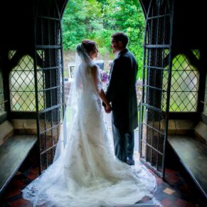 Silhouette wedding photography in Buckinghamshire church doorway