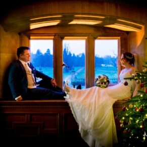 Classic wedding photography in Buckinghamshire - Window silhouette pose of the newlyweds
